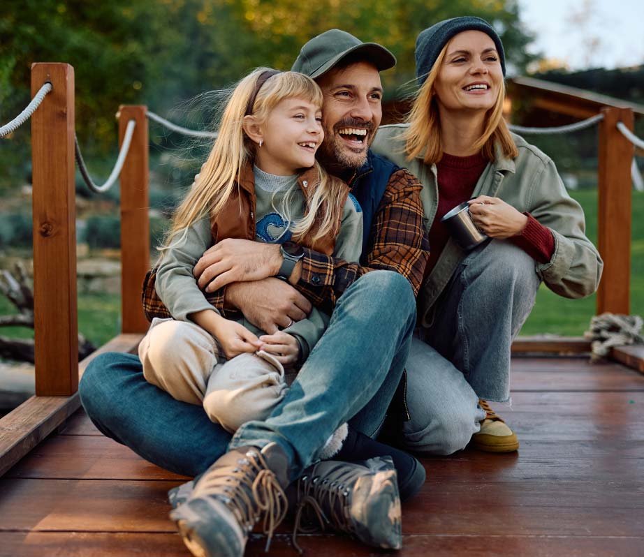 Frey Dock And Barge Idaho Dock Building family in north idaho sitting on a dock smiling